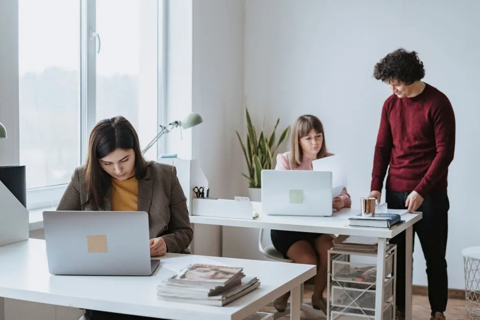 Coworkers collaborating together at an office desk